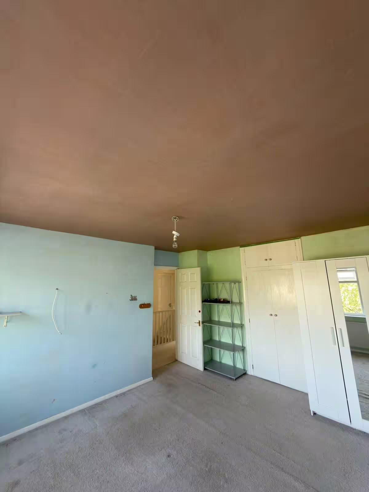 The same ceiling skimmed flat in fresh plaster, floor cleared and the sheets up